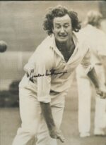 SIGNED PHOTOGRAPH: Graham McKenzie bowling